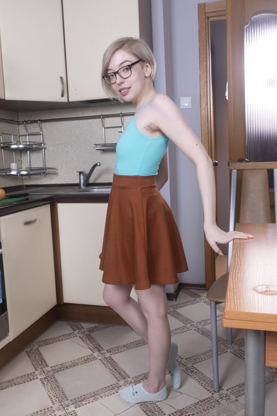 Amateur teen Abby shows off her hairy pussy & armpit in the kitchen