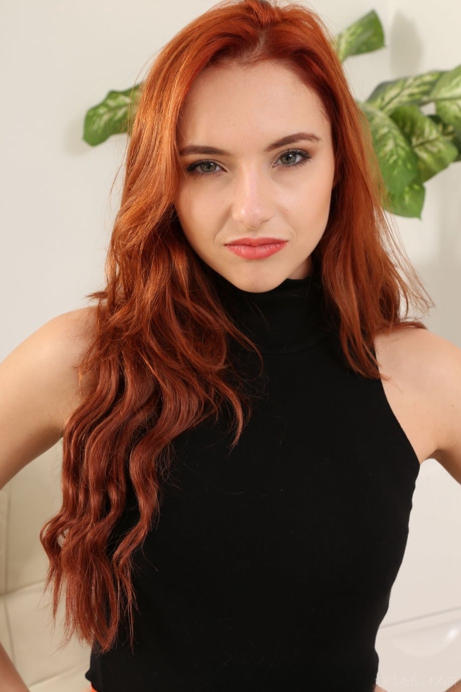 Model with red wavy hair Sophia Blake undresses & poses in sheer tights