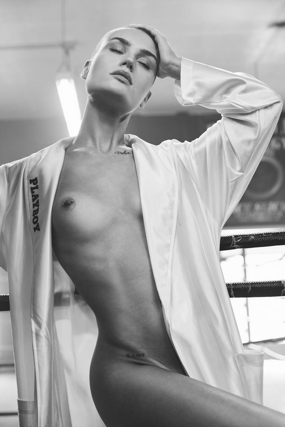 Shots of bald skinny girl Vendela in boxing clothes and naked in a ring
