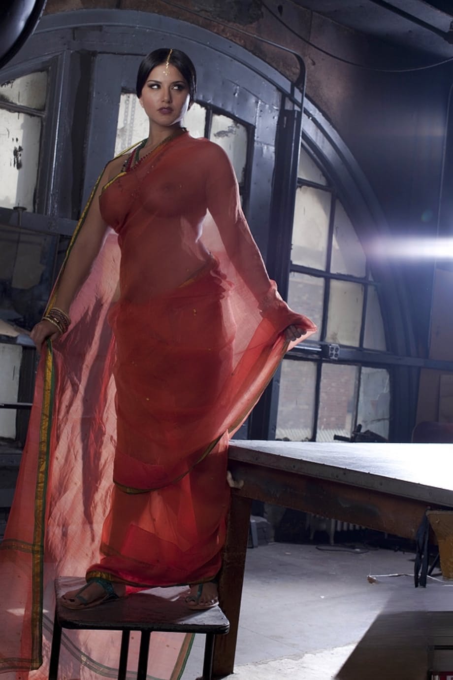 Busty solo girl Sunny Leone models solo in see thru Indian attire