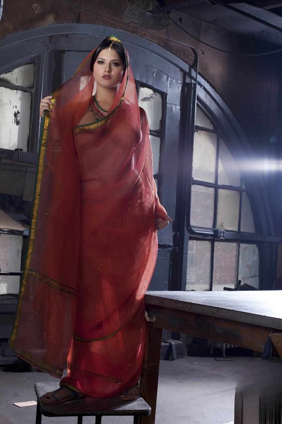 Busty solo girl Sunny Leone models solo in see thru Indian attire
