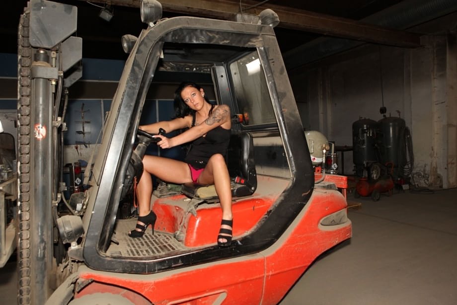 Plump tattooed German chick Kate models topless & rides cock in the garage