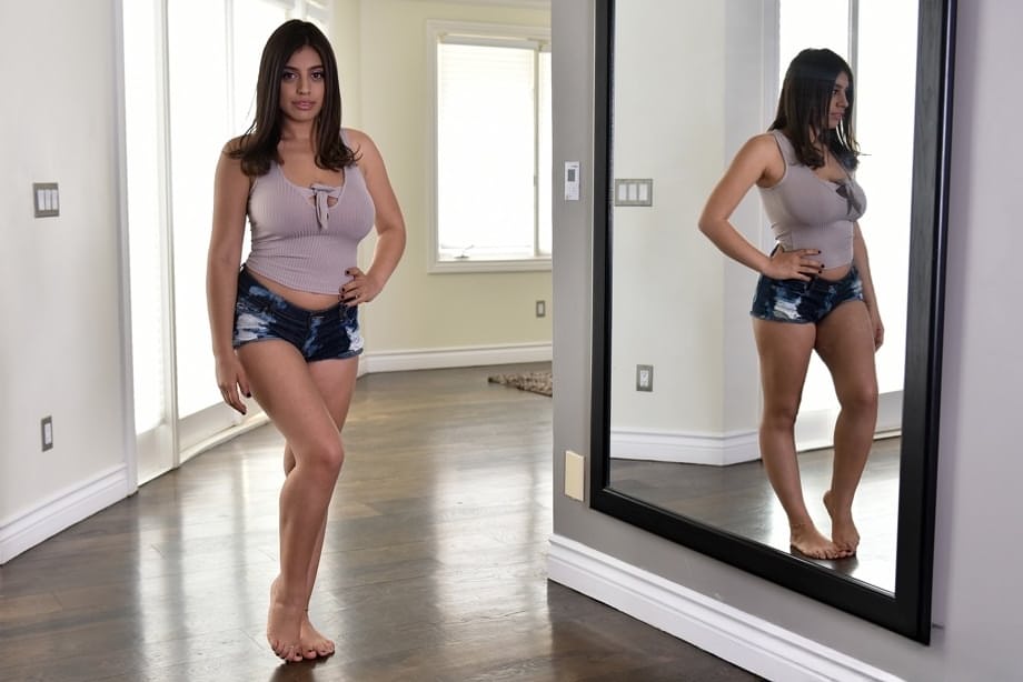 Chubby busty Ella Knox frees her huge natural tits to pose naked on the floor