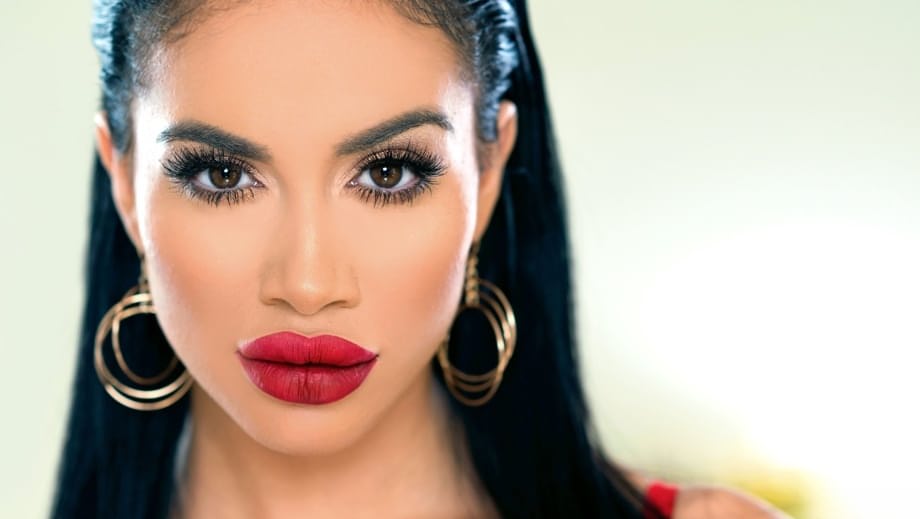 Fake titted Latina Victoria June flaunts her big red lips & flashes pussy