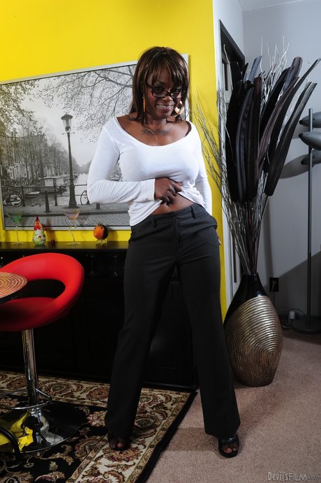 Busty ebony granny Coco Pink gets her clothes off only for your eyes