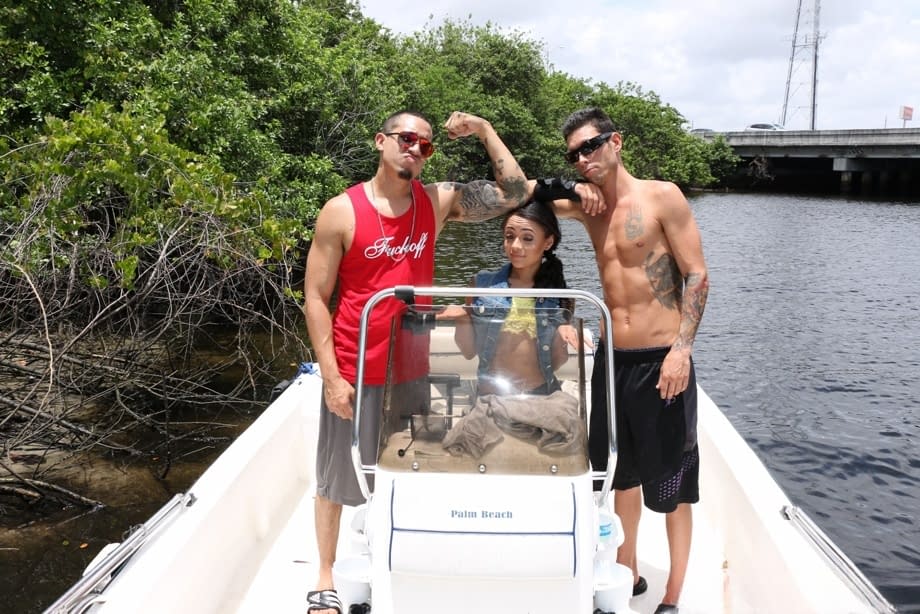 Petite Latina babe Holly Hendrix strips and poses sexily on the boat