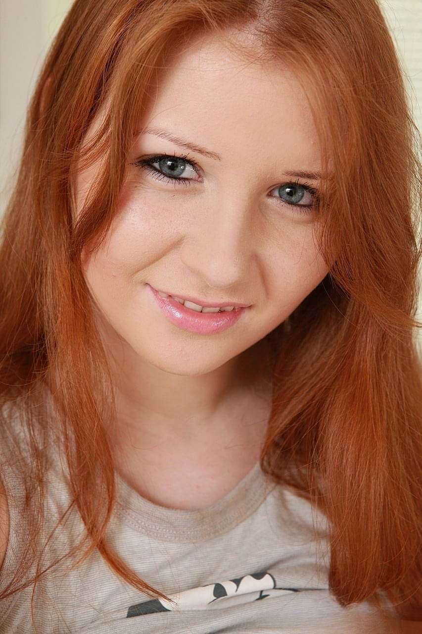 Innocent redhead Jess shows her big tits and masturbates with a dildo