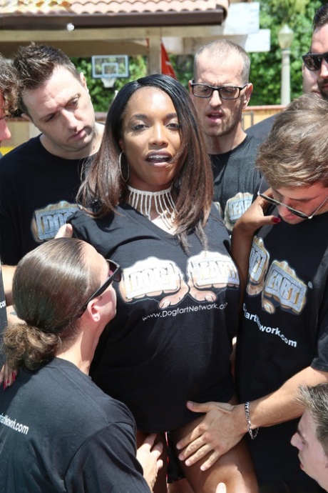 Busty black girl Daya Knight gets on her knees in the backyard for a blowbang