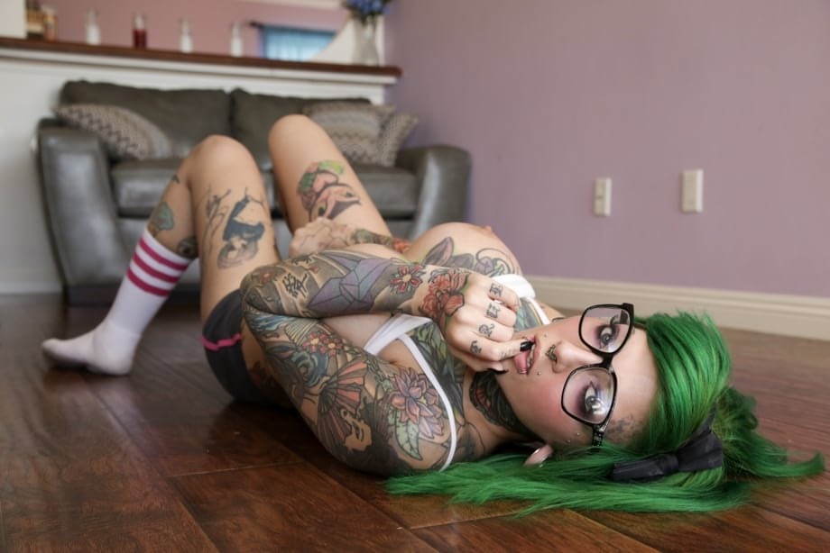 Green haired glasses wearing hottie exposes huge melons & spreads pussy lips