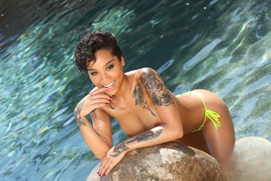 Divine chocolate Honey Gold with tattoos exposes nude body by the pond