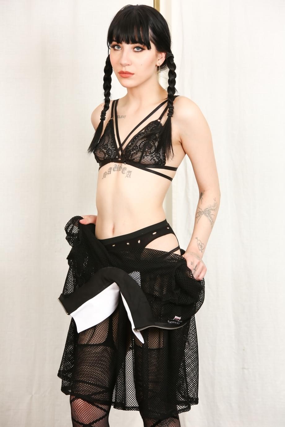 Tall thin Charlotte Sartre as Wednesday Addams strips her sheer dress to spread