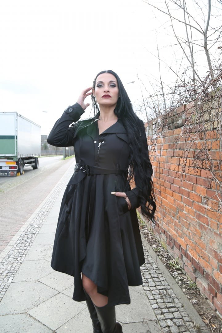 Gorgeous black haired German MILF reveals bulbous & massive big tits outdoors