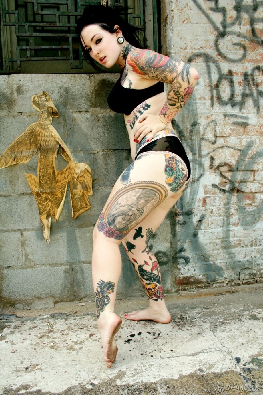 Gorgeous fetish girl Adahlia reveals her big tits & big tattoos outdoors