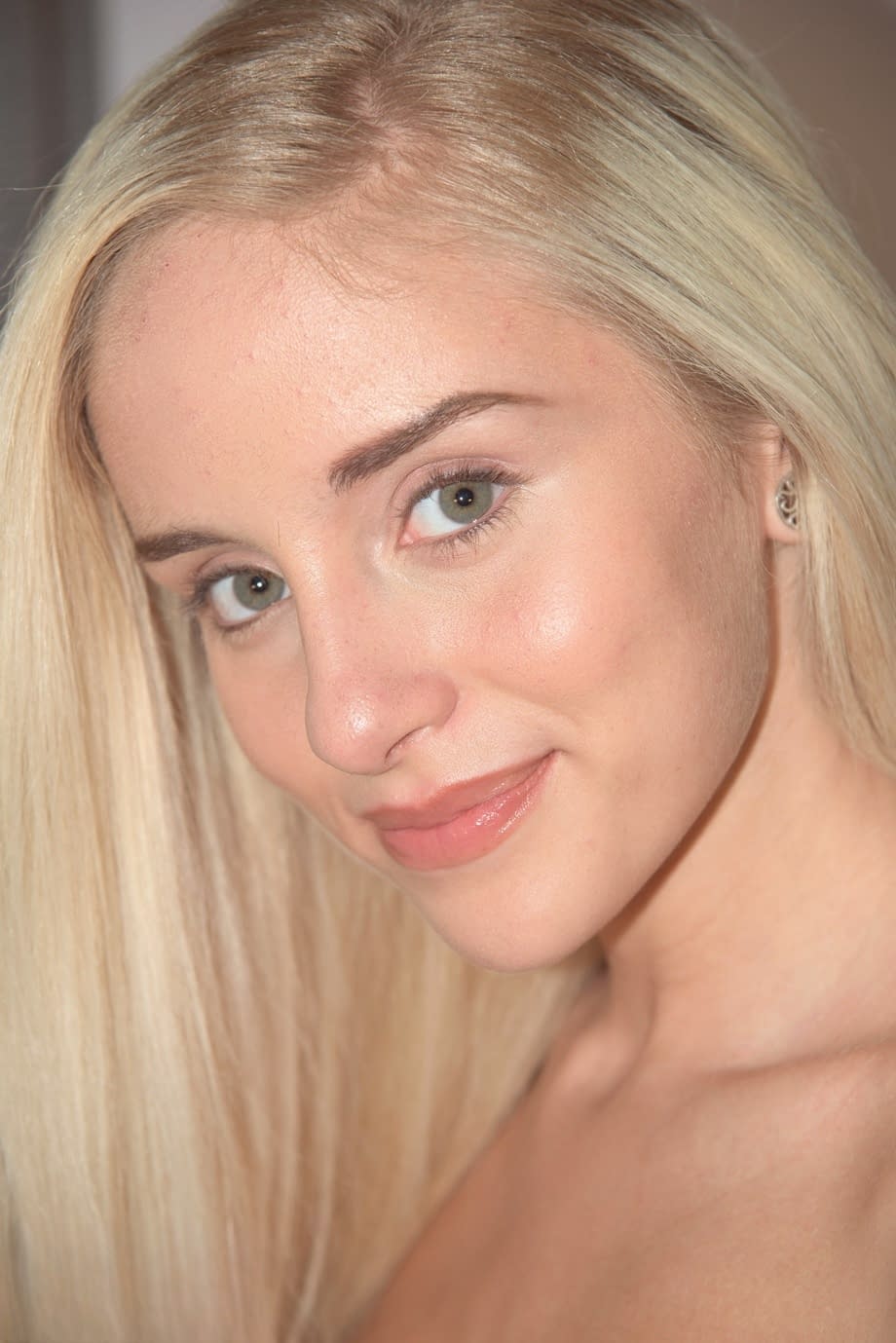 Young blonde girl Naomi Woods fingers her barely legal twat while masturbating