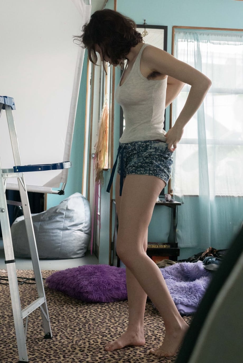Slender Charlee shows nice tits and thick underarm hair while getting dressed
