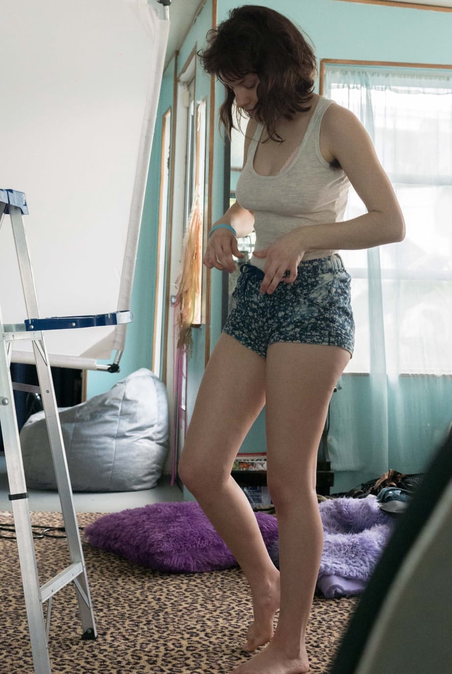 Slender Charlee shows nice tits and thick underarm hair while getting dressed