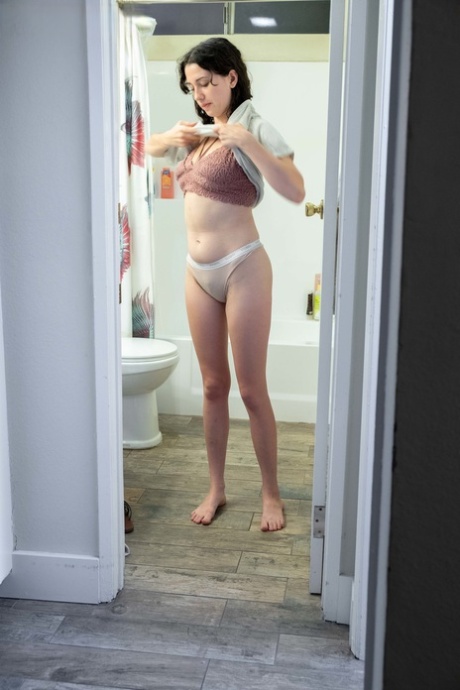 Naked brunette with natural bush Mary J caught getting dressed in the bathroom