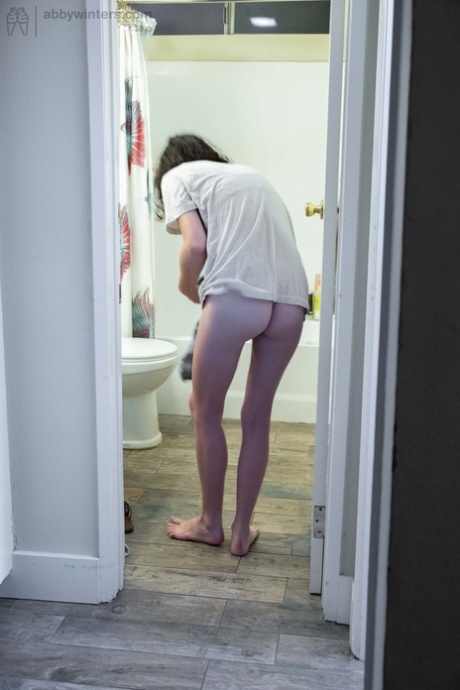Naked brunette with natural bush Mary J caught getting dressed in the bathroom