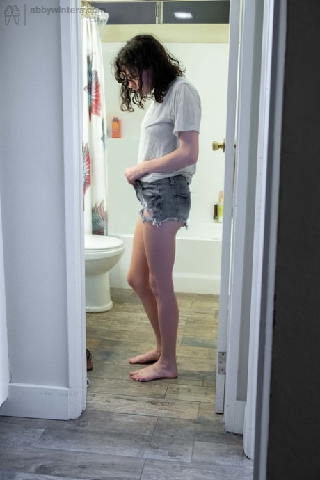 Naked brunette with natural bush Mary J caught getting dressed in the bathroom