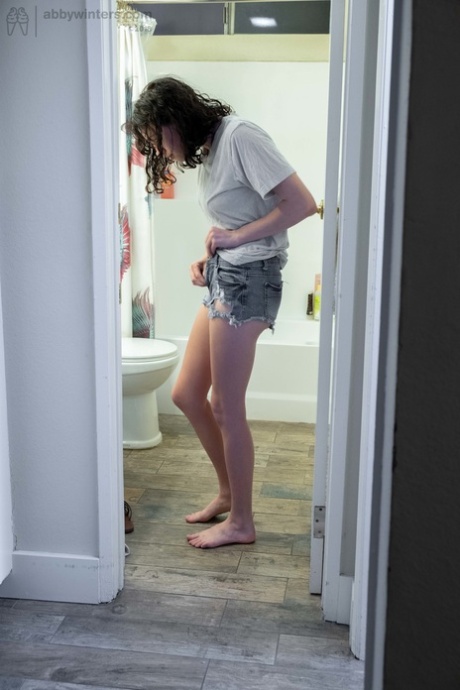 Naked brunette with natural bush Mary J caught getting dressed in the bathroom