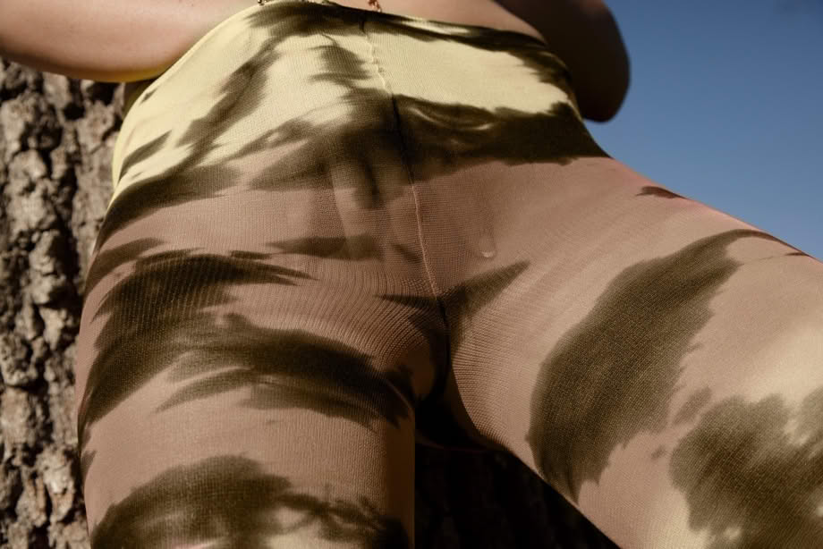 Sexy teen girlfriend Delilah Blue poses in tight camo leggings and shows tits