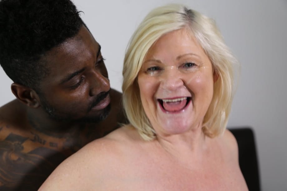 Chubby blonde granny Lacey Starr tastes a black cock before riding it