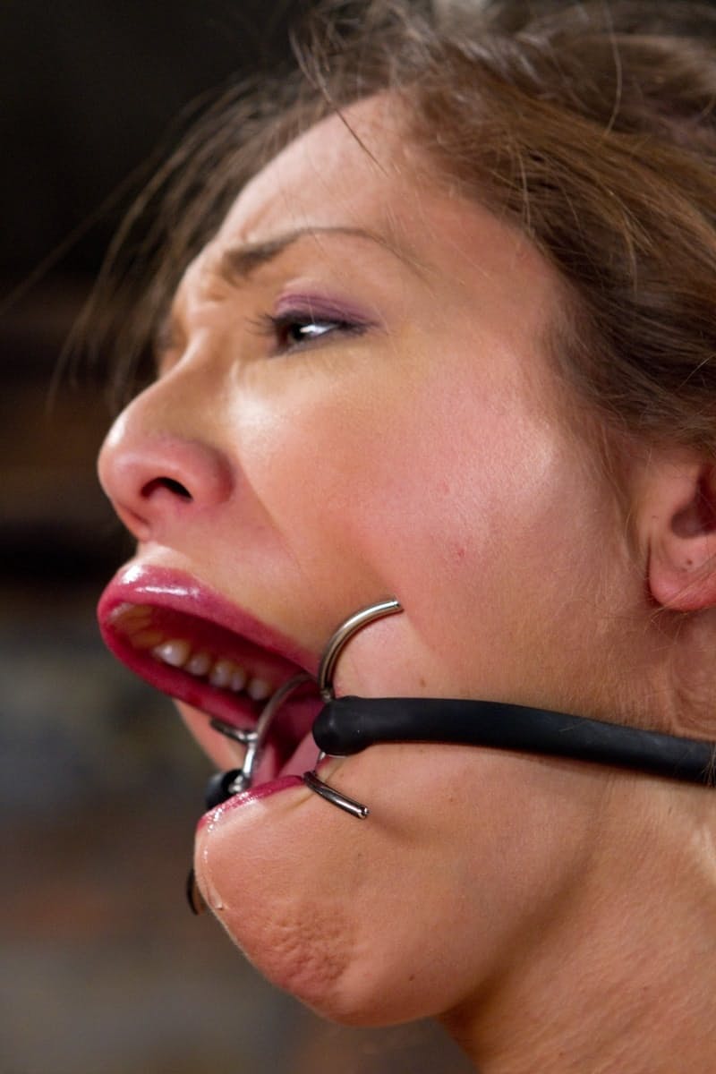 Sexy girl Audrey Rose endures extreme mouth spreading and tit torment