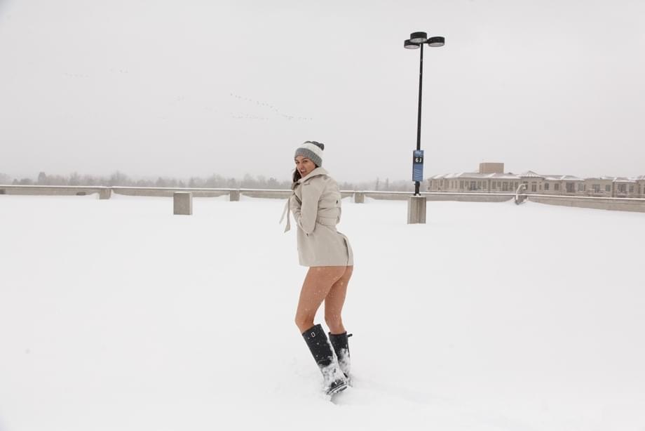 American solo girl Laina Shendoah parades thru the snow in a toque and boots