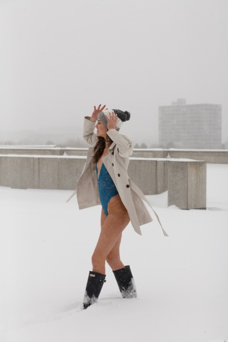 American solo girl Laina Shendoah parades thru the snow in a toque and boots