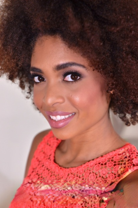 Black chick with an afro Luna Corazon plunges a couple of fingers into pussy