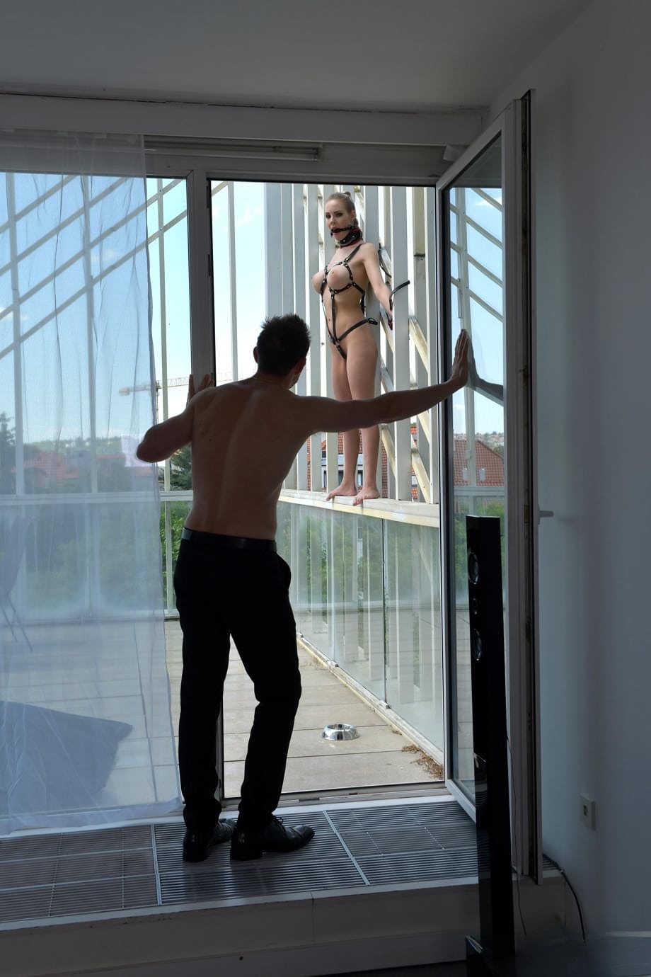 Busty Florane Russell in ball gag & harness displayed outdoors before anal sex