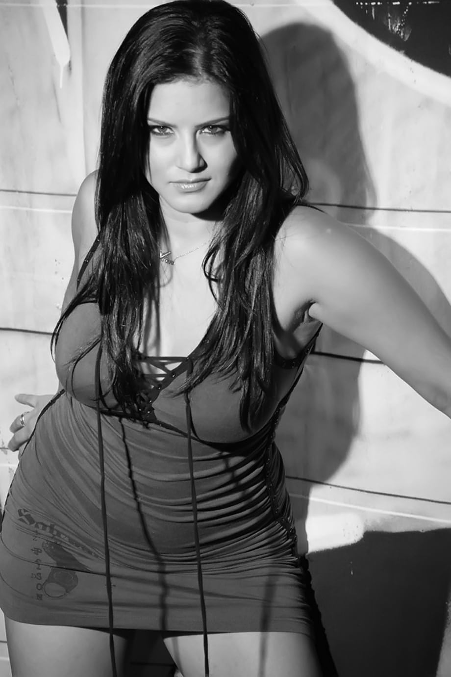 Indian model Sunny Leone shows off her pretty face and nice legs in a dress