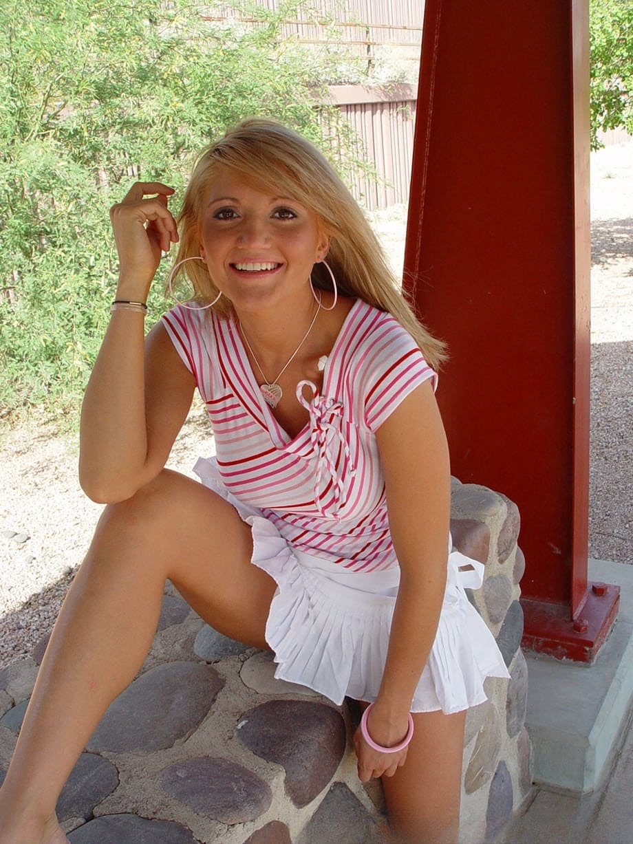 Blonde teen Spring Thomas exposes her bare ass on a public sidewalk