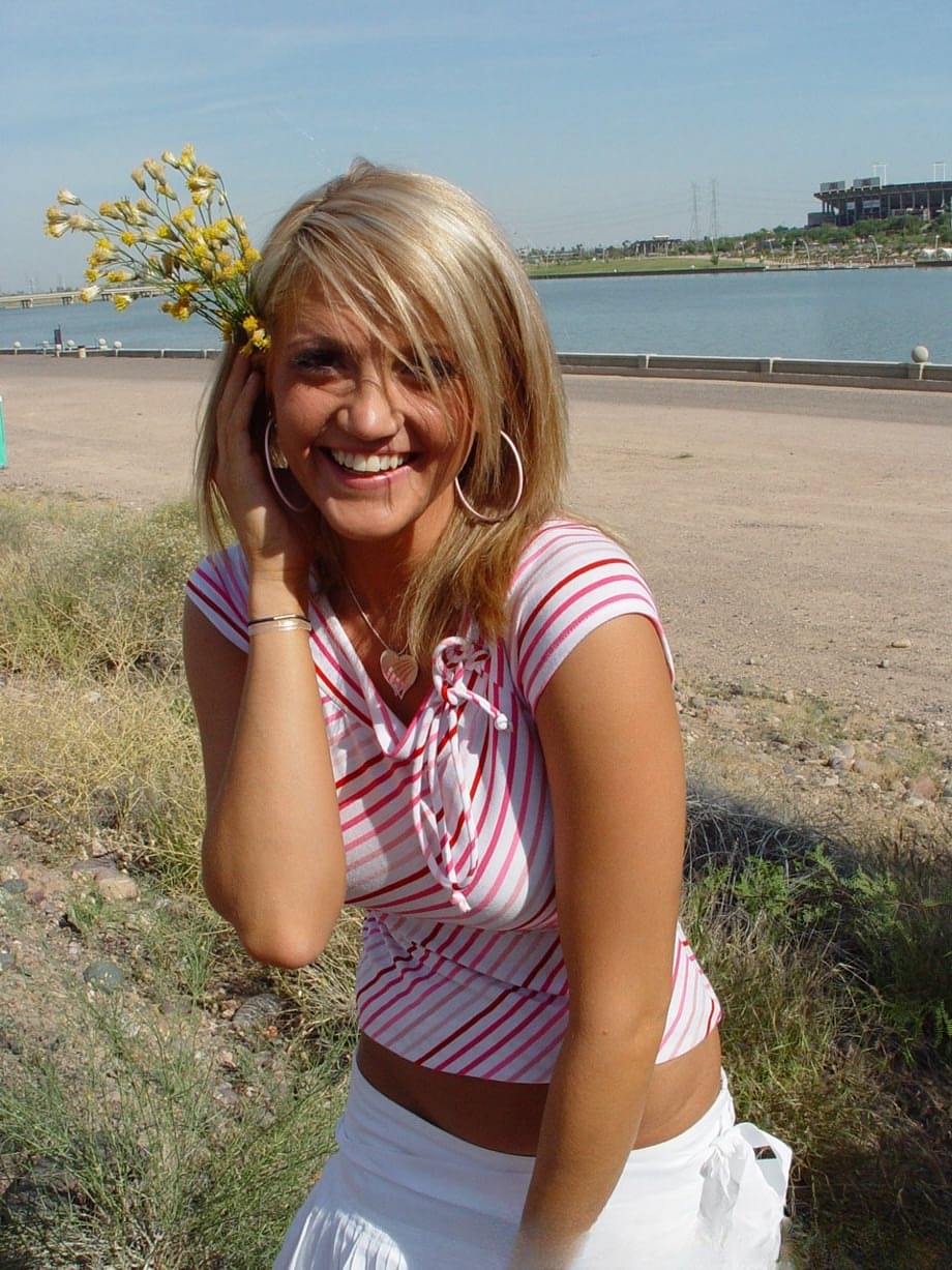 Blonde teen Spring Thomas exposes her bare ass on a public sidewalk