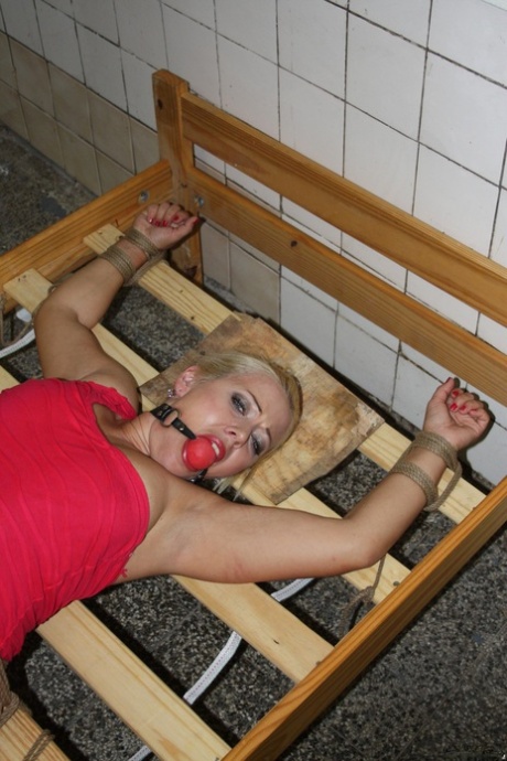Poor blonde Veronica with naked sweet pussy tied up on a strange bed