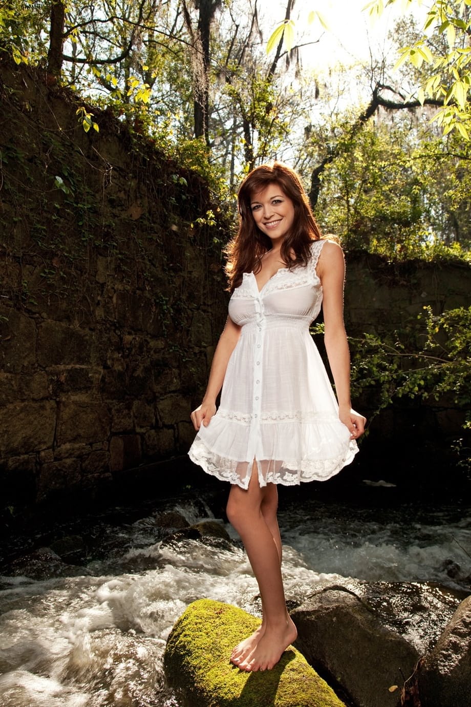 Lovely Tessa Fowler loses her white dress in nature and reveals giant boobs