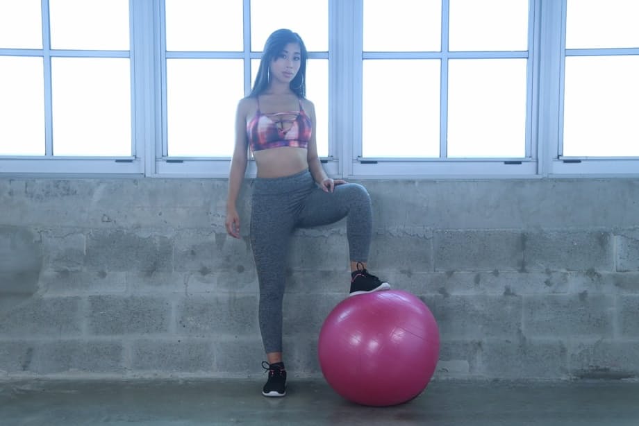Petite Asian teen Jade Kush posing butt naked on stability ball