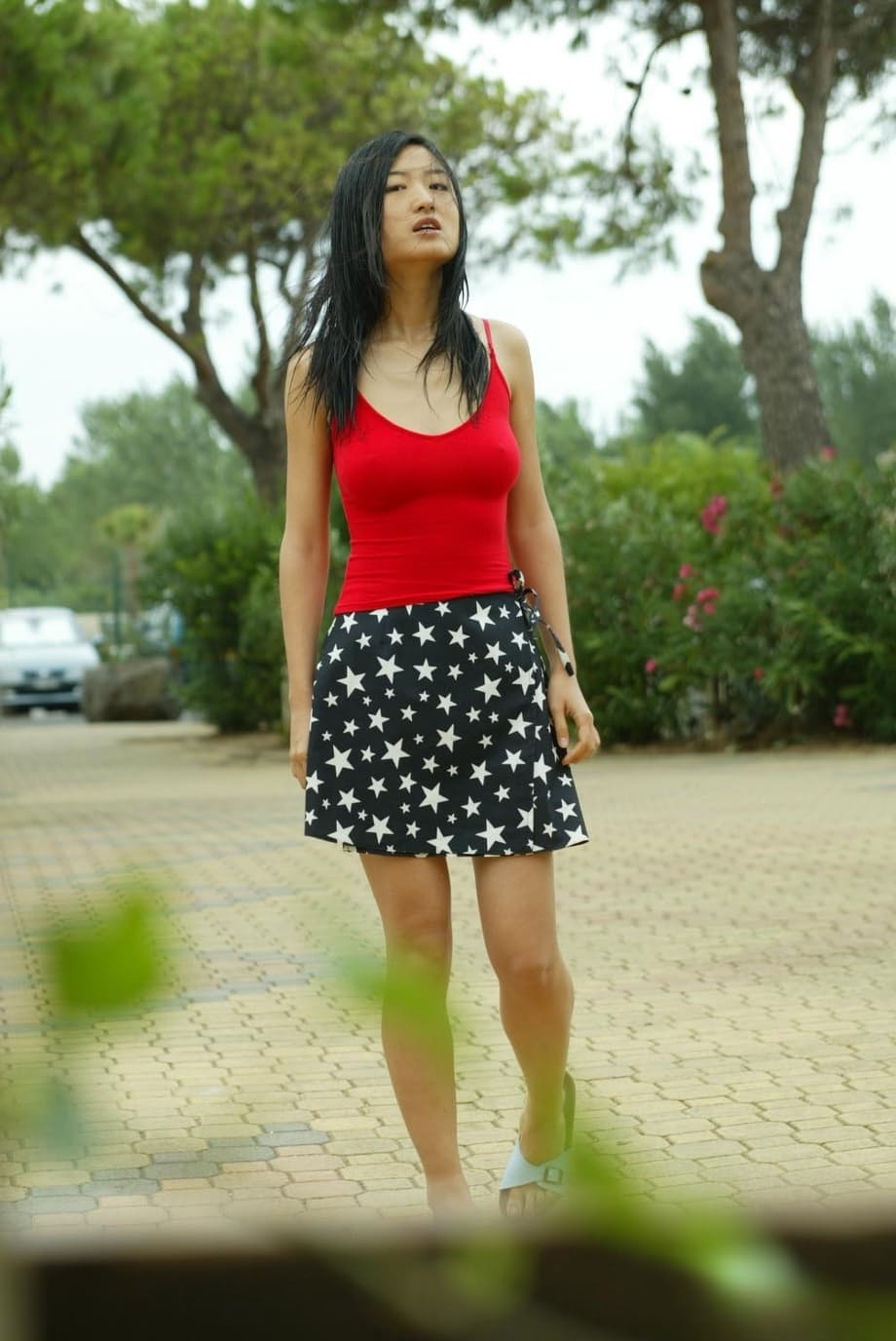 Busty Oriental teen Yuka B exposes her nice tits and full bush in public place