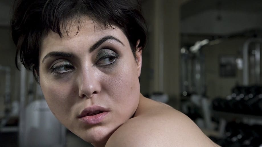 Audrey Noir and Mistress Kara have strapon lesbian sex over gym equipment