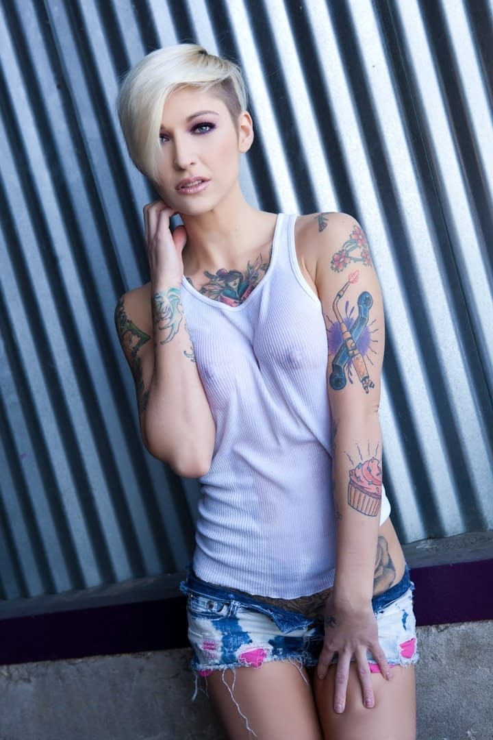 Alluring blonde babe with short hair and slender body showing off in solo act