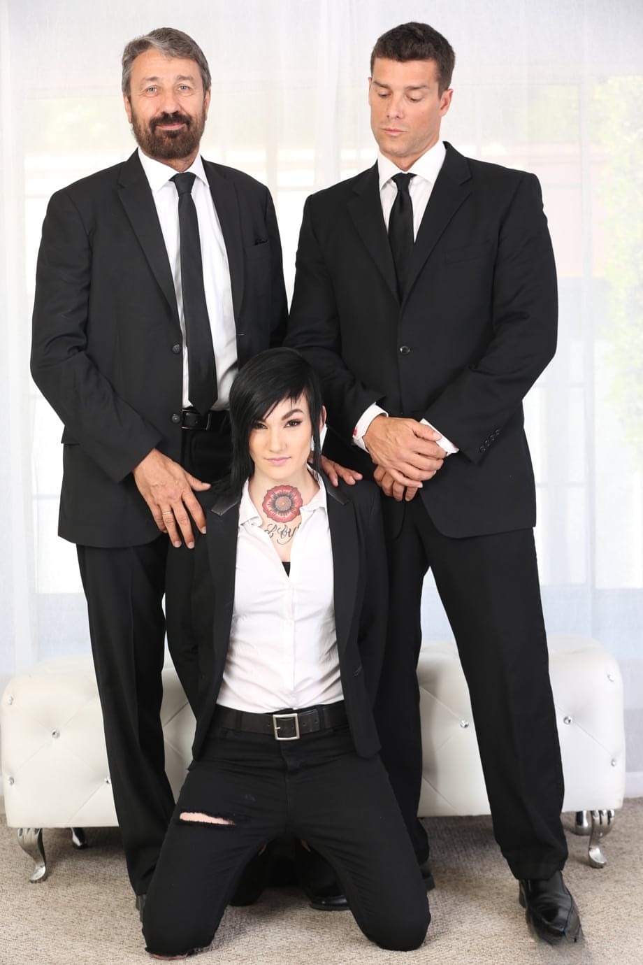 Dark haired girl Nikki Hearts has sex with 2 male co-workers at the same time