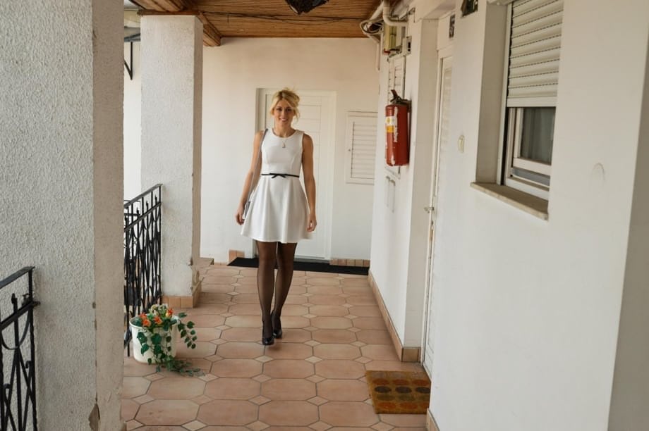 Blonde beauty Kat reveals sheer panties & garter under dress in casting shoot