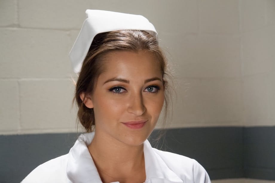 Gorgeous nurse with a nice butt Dani Daniels strips and poses in high heels