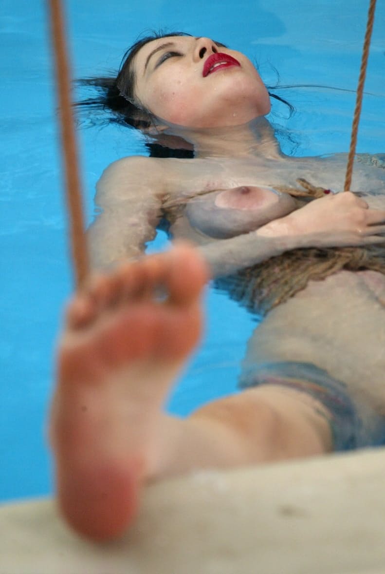 Sweet Asian sex slave June Mizuna gets toyed with while rope bound in the pool