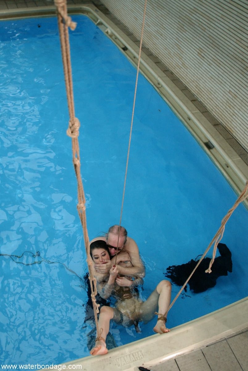 Sweet Asian sex slave June Mizuna gets toyed with while rope bound in the pool