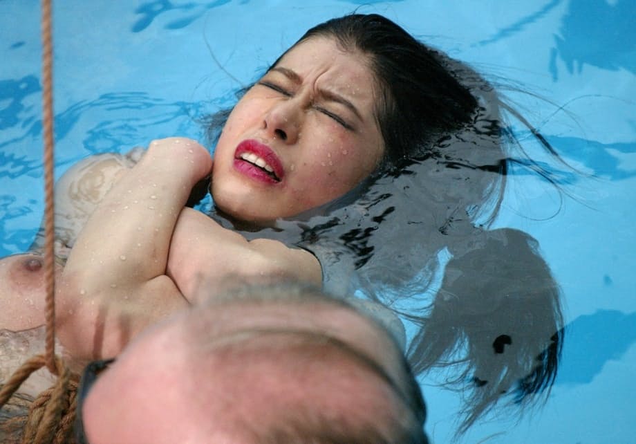 Sweet Asian sex slave June Mizuna gets toyed with while rope bound in the pool