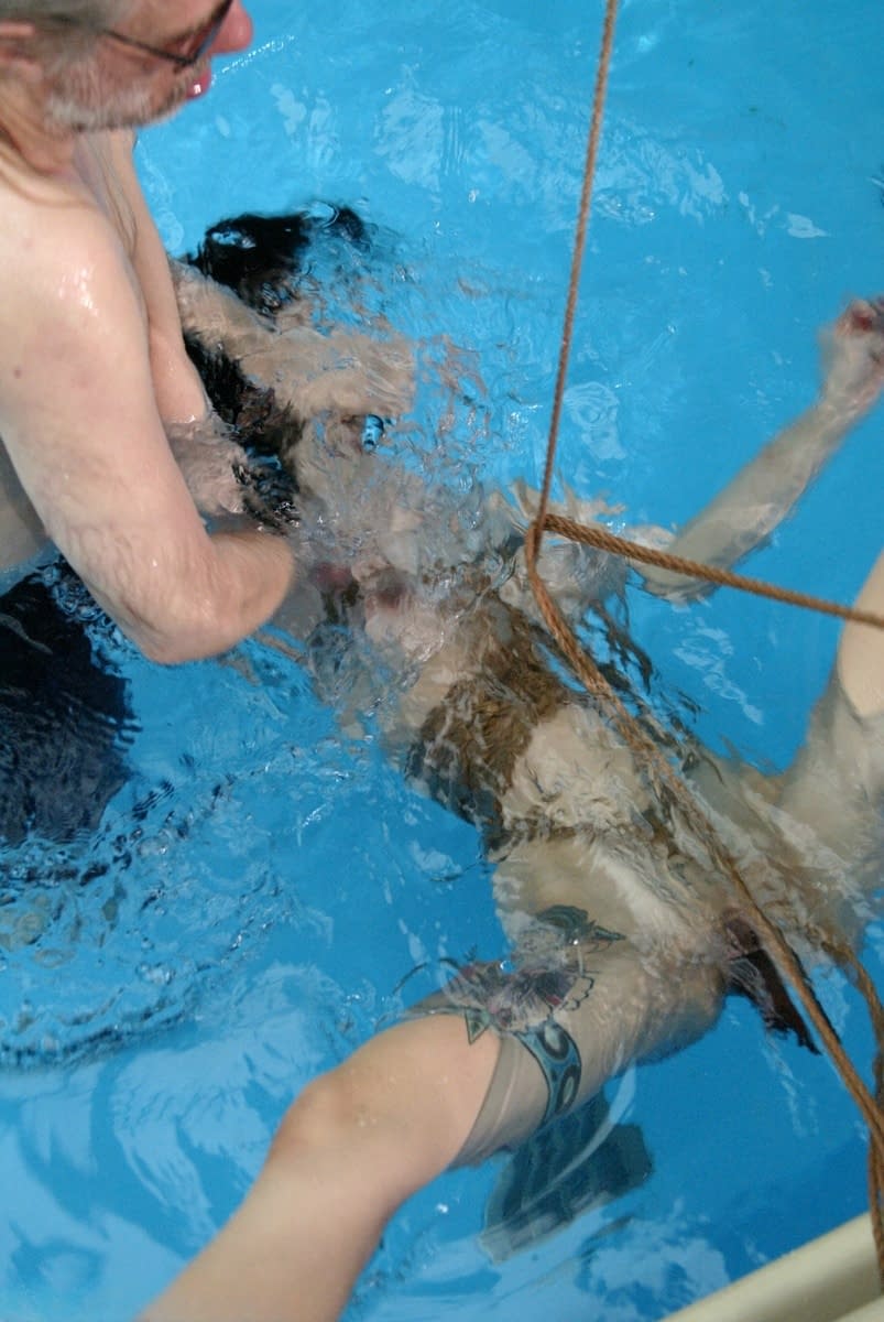 Sweet Asian sex slave June Mizuna gets toyed with while rope bound in the pool