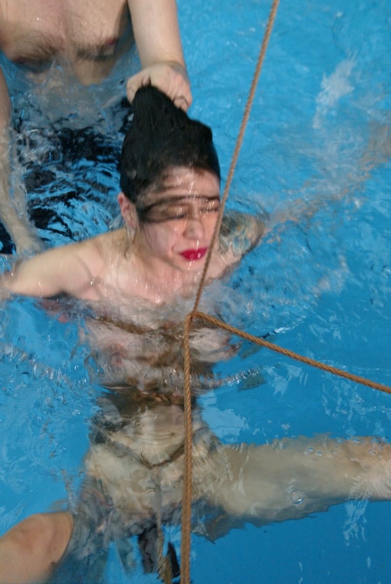 Sweet Asian sex slave June Mizuna gets toyed with while rope bound in the pool