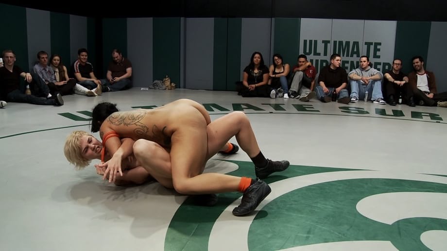 Wrestlers give up a bout to begin being masturbated by a referee