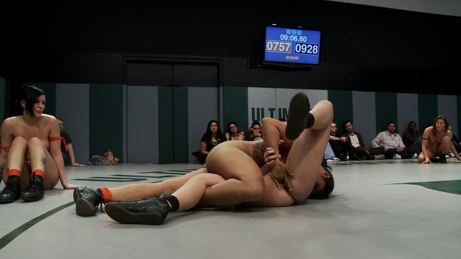 Wrestlers give up a bout to begin being masturbated by a referee